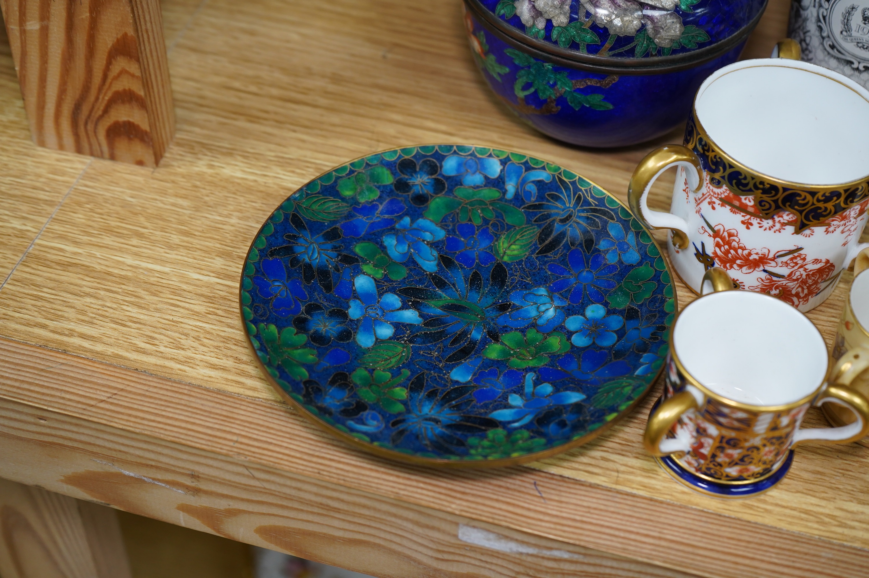 Porcelain and cloisonné ware to include a box and cover, a modern cloisonne dish, Royal crown Derby tygs and two cups and saucers, largest 10cm high. Condition - fair to good